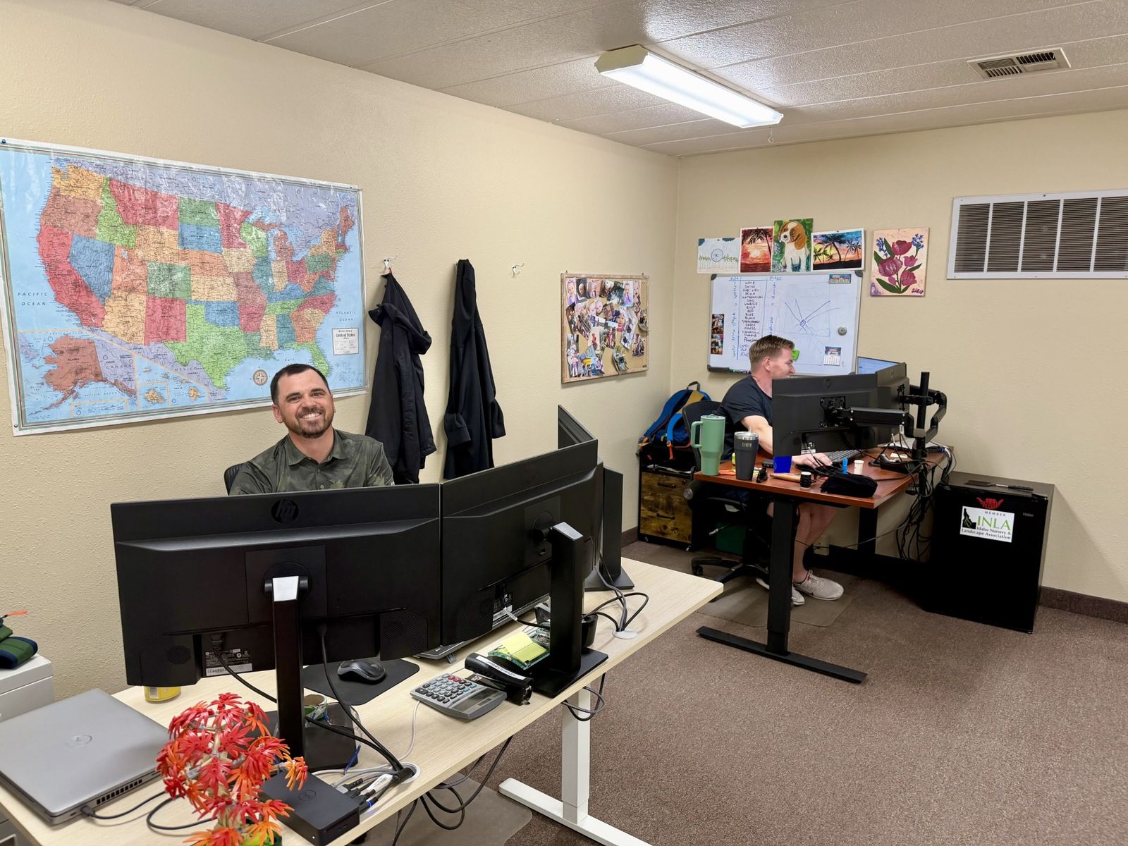 Tree Source sales team helping customers from their desks at a branch office