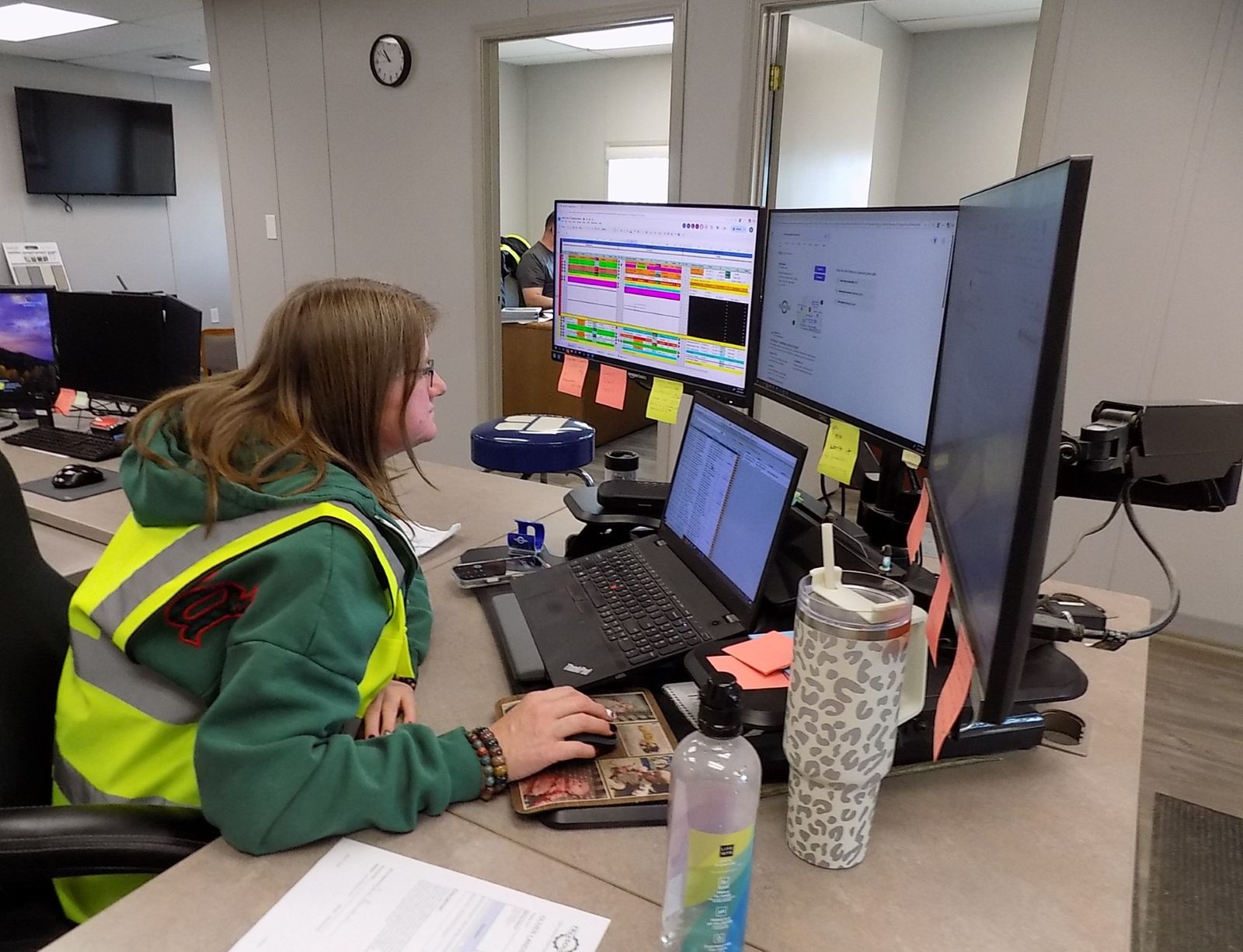Tree Source team member coordinating delivery schedules on a dispatch board at a branch office