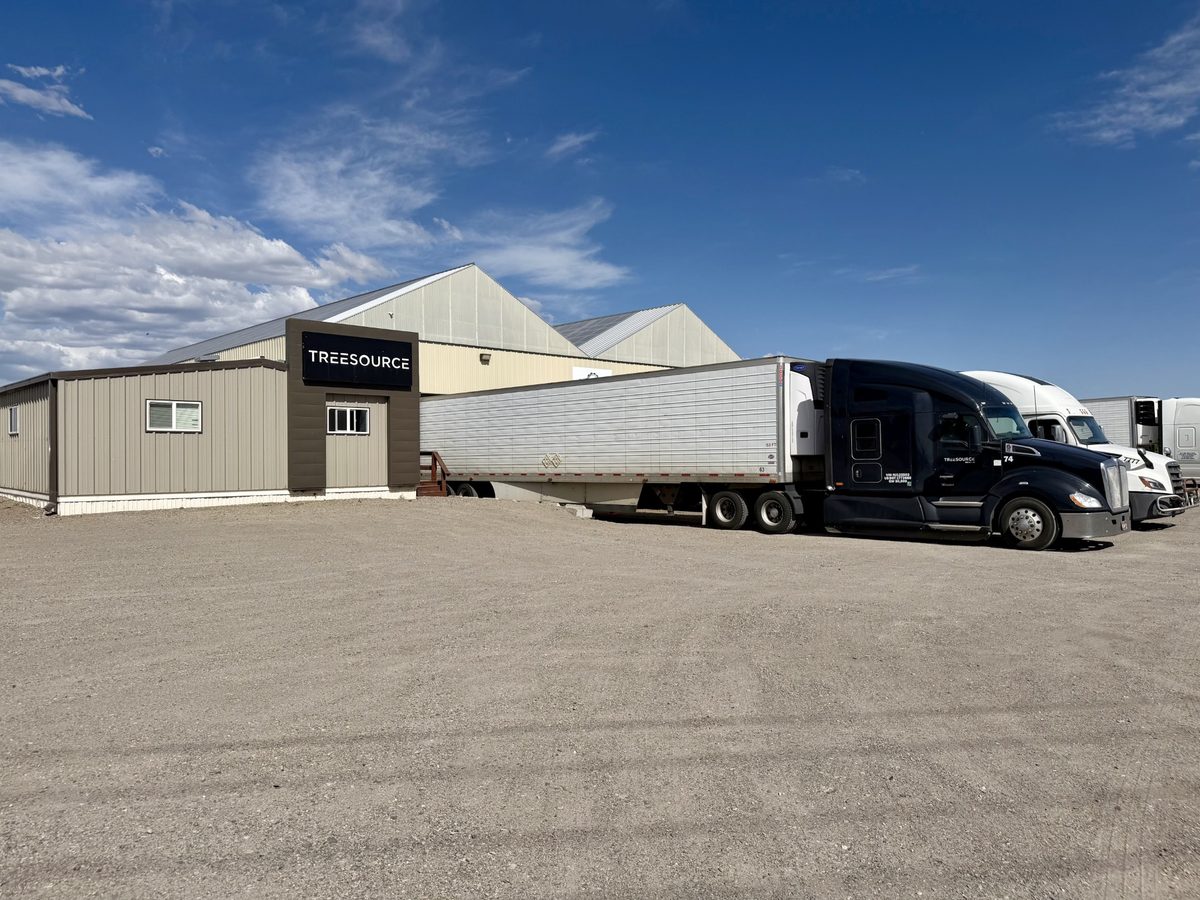 Tree Source branded delivery trucks at the loading dock of the Rupert, Idaho farm